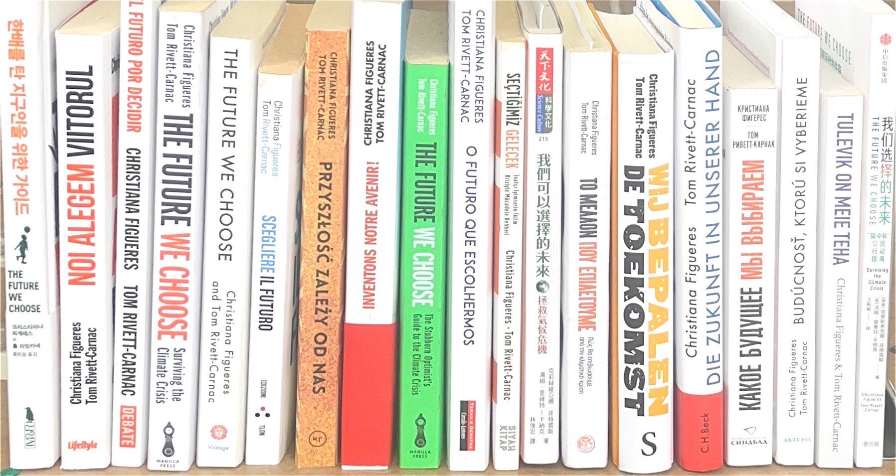 All translations of The Future We Choose lined up on a shelf